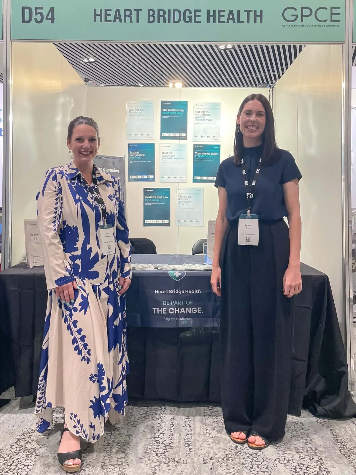 Two Heart Bridge Health team members standing at the GPCE stand