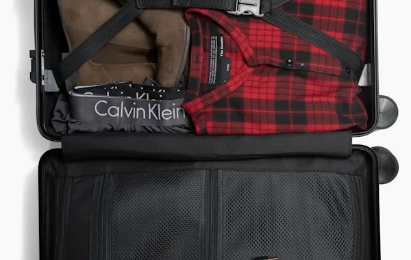 A packed suitcase, ready to relocate